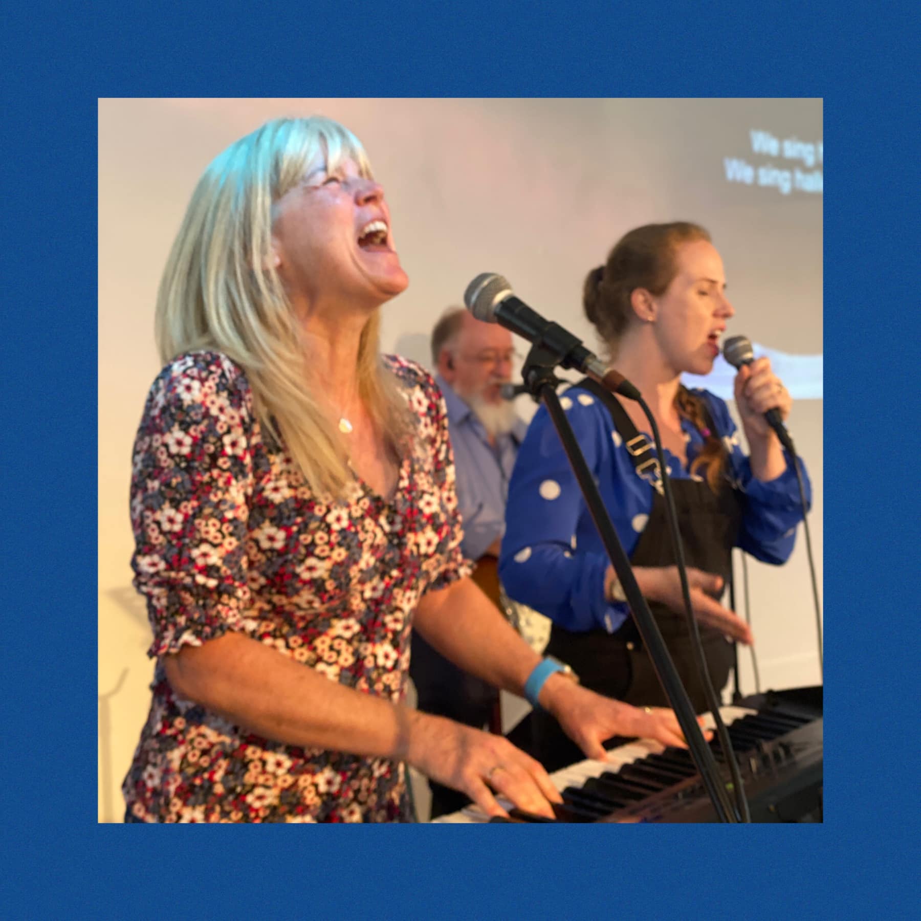 Worship team singing at The Well Church